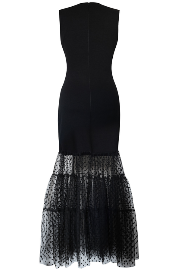 Sustainable apparel companies example - Black dress with polka dot tulle skirt, zipper down the middle back.