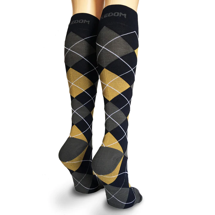 Black and gold argyle socks worn in back view.