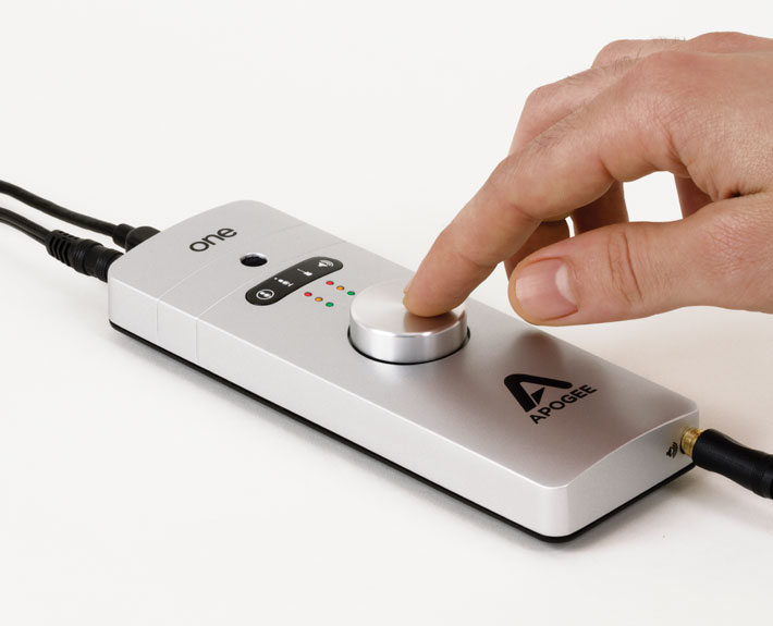 Remote control button being pressed on Apogee ONE USB audio interface by person.
