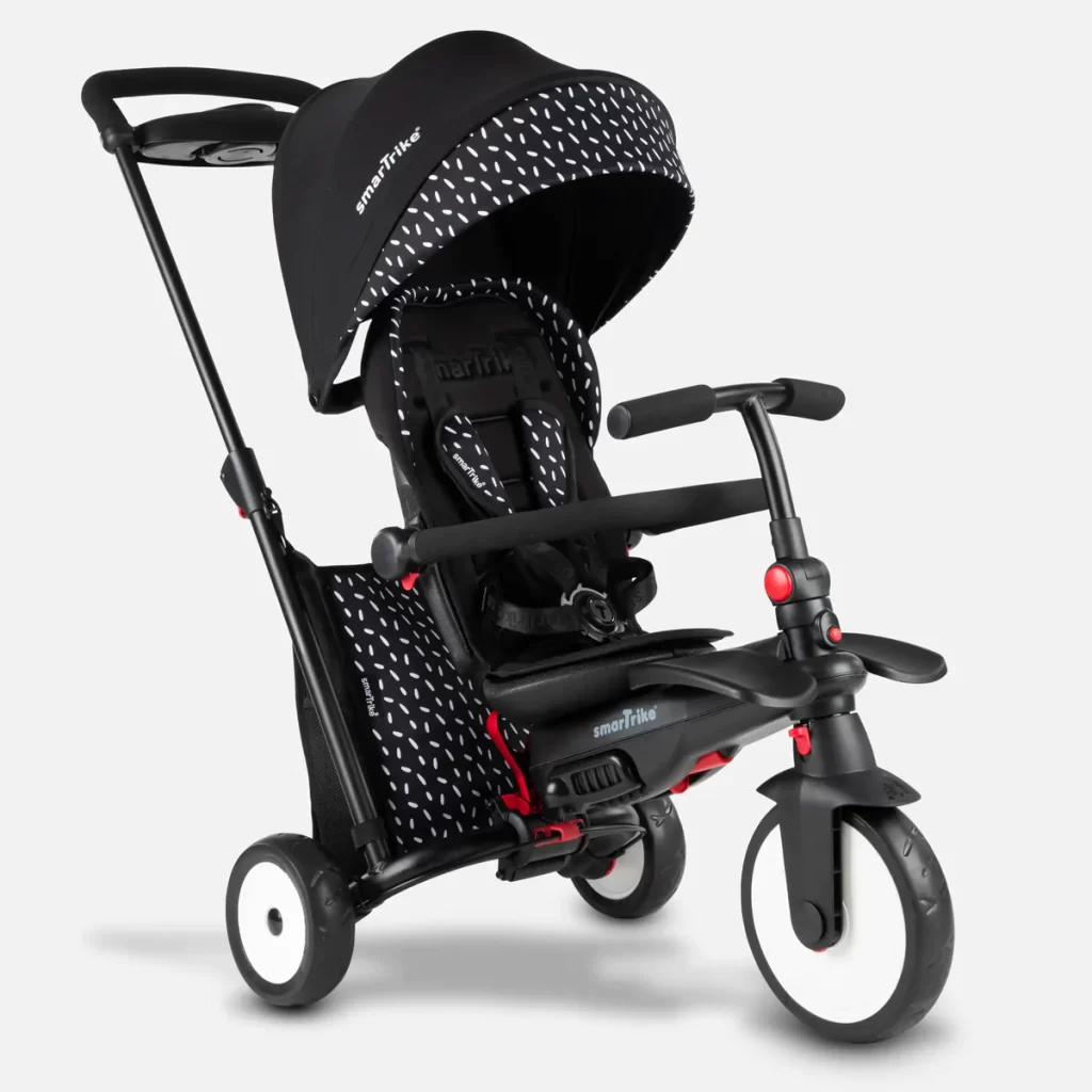 A stylish baby stroller with black and white polka dots, perfect for a trendy little one on the go!