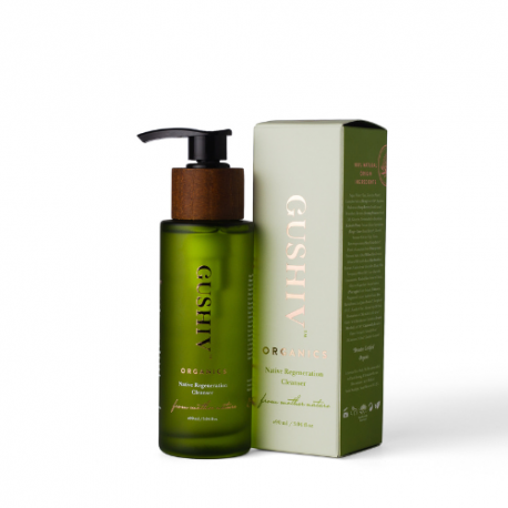 A Gushiv Organic face cleanser with a green body, black spray dispenser, and whitish-green packaging, showcased against a white background.