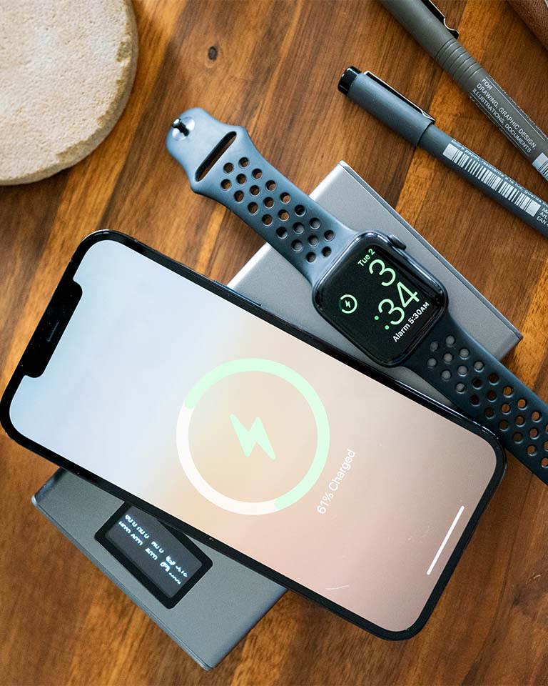 The FLASH PRO PLUS: USB-C 25000mAh Graphene Power Bank wirelessly charges an iPhone and Apple Watch with MagSafe Compatibility.