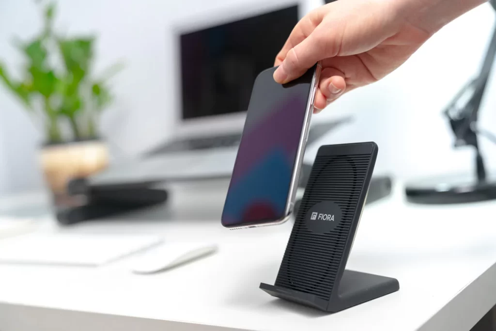  Say goodbye to tangled wires with this top-notch wireless charging stand for your phone. It's equipped with Qi fast charge technology and a cooling fan - a game-changer by Fiora!