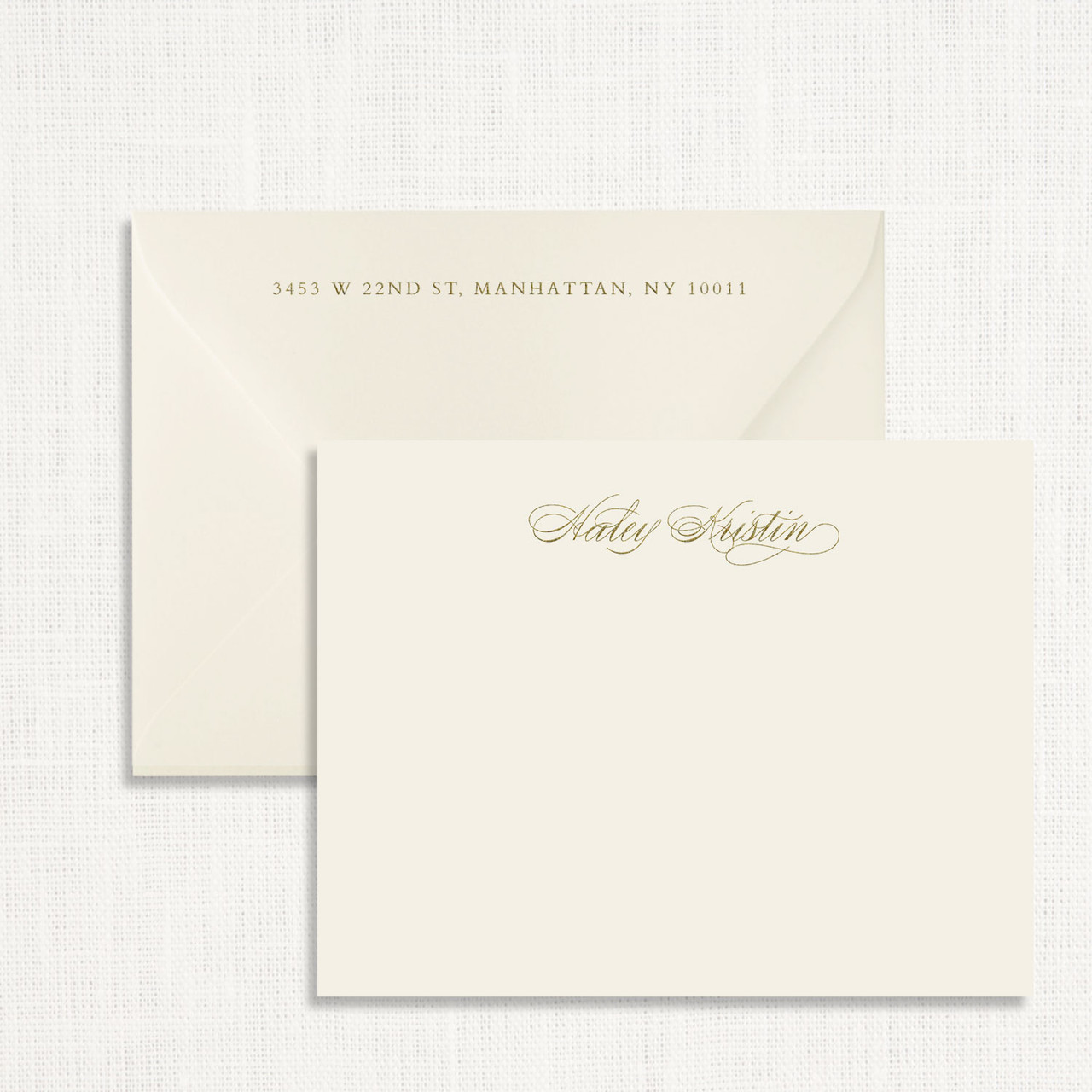 Personalized stationery card with raised gold lettering and a hand-lined envelope, representing a thoughtful add-on for last-minute valentine deals.