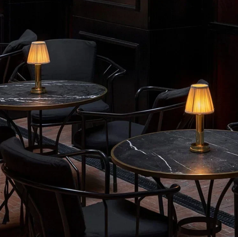 Cordless table lamp emitting warm ambient light in a softly styled room, illustrating an intentional at-home setup for last-minute valentine deals.