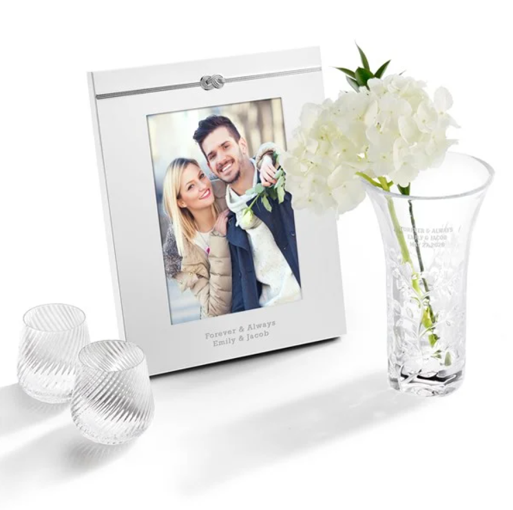 Engraved crystal vase and 8×10 photo frame displayed together on a neutral surface, representing best personalized gift services for classic keepsakes.
