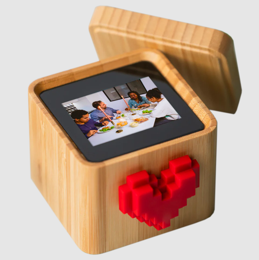 Connected messaging box with a spinning red heart on top and a digital message inside, featured among best personalized gift services for long-distance relationships.